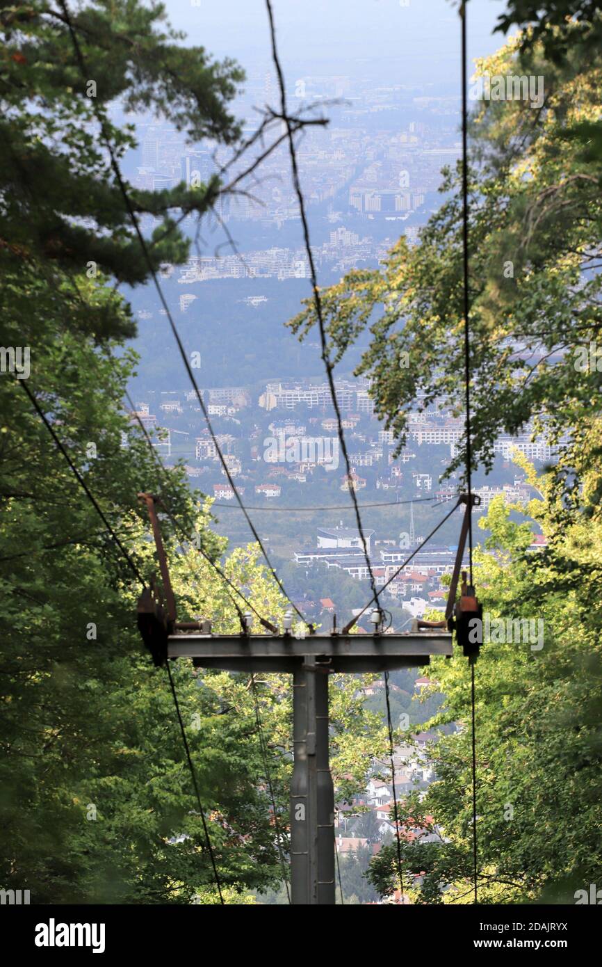 From the popular panoramic Dragalevski lift in Vitosha Mountain, to the capital of Bulgaria - Sofia, only the pillars remain. The outdoor chair Dragal Stock Photo