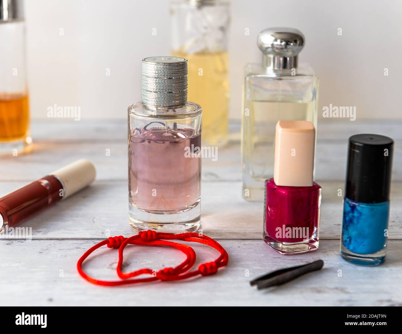 Different types and shapes of bottles of perfumes Stock Photo