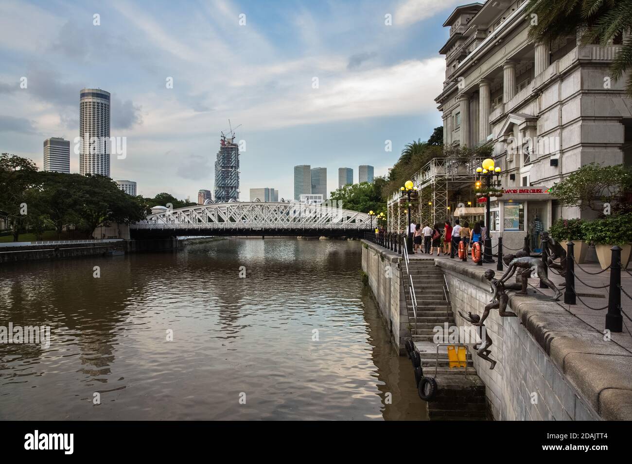 SINGAPORE - DECEMBER 9, 2014: View of the sculpture composition of the 'First Generation' sculptor by Chong Fah Cheong on the Singapore River, Distric Stock Photo