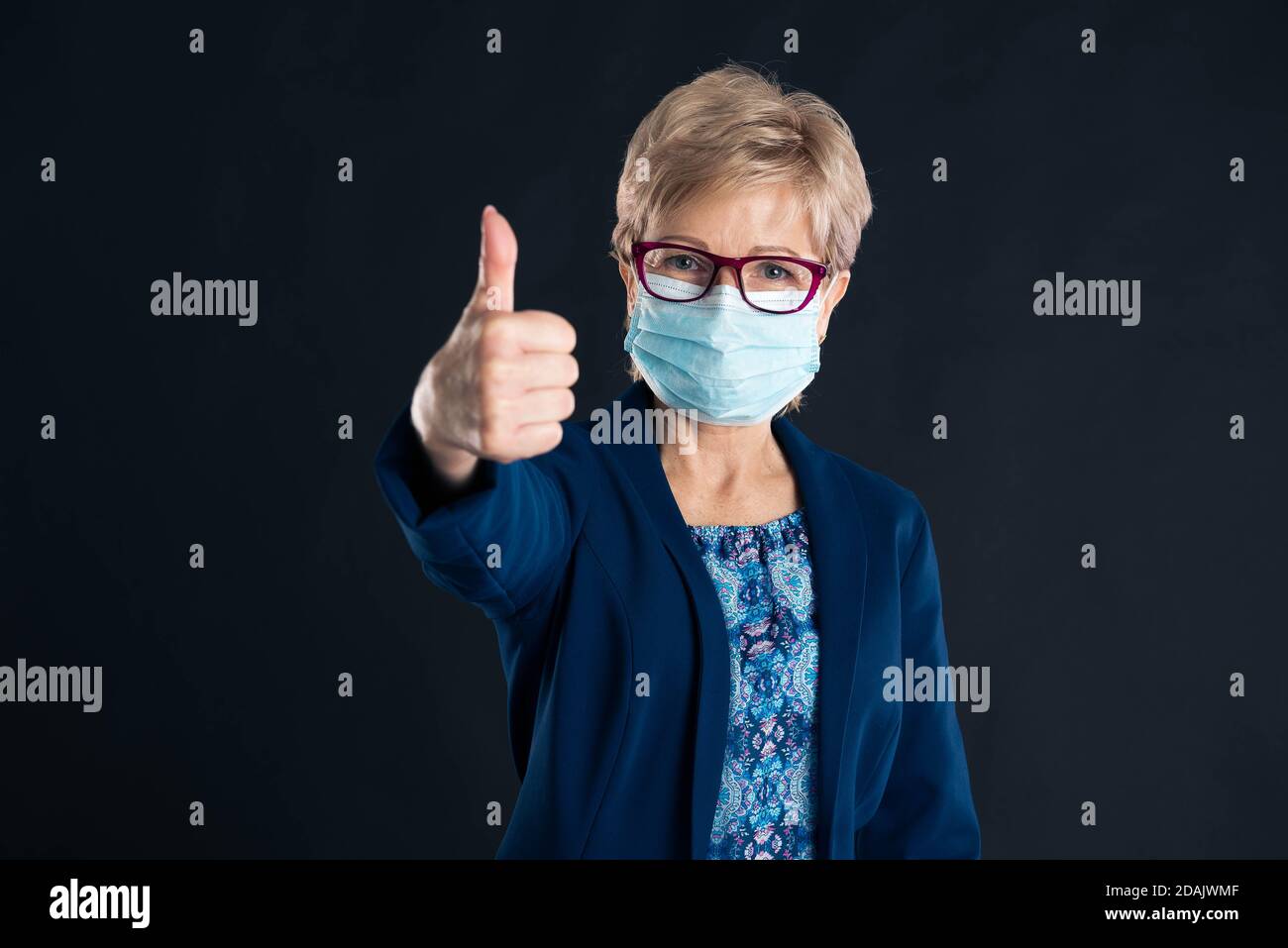 Older woman wearing a mask hi-res stock photography and images - Alamy
