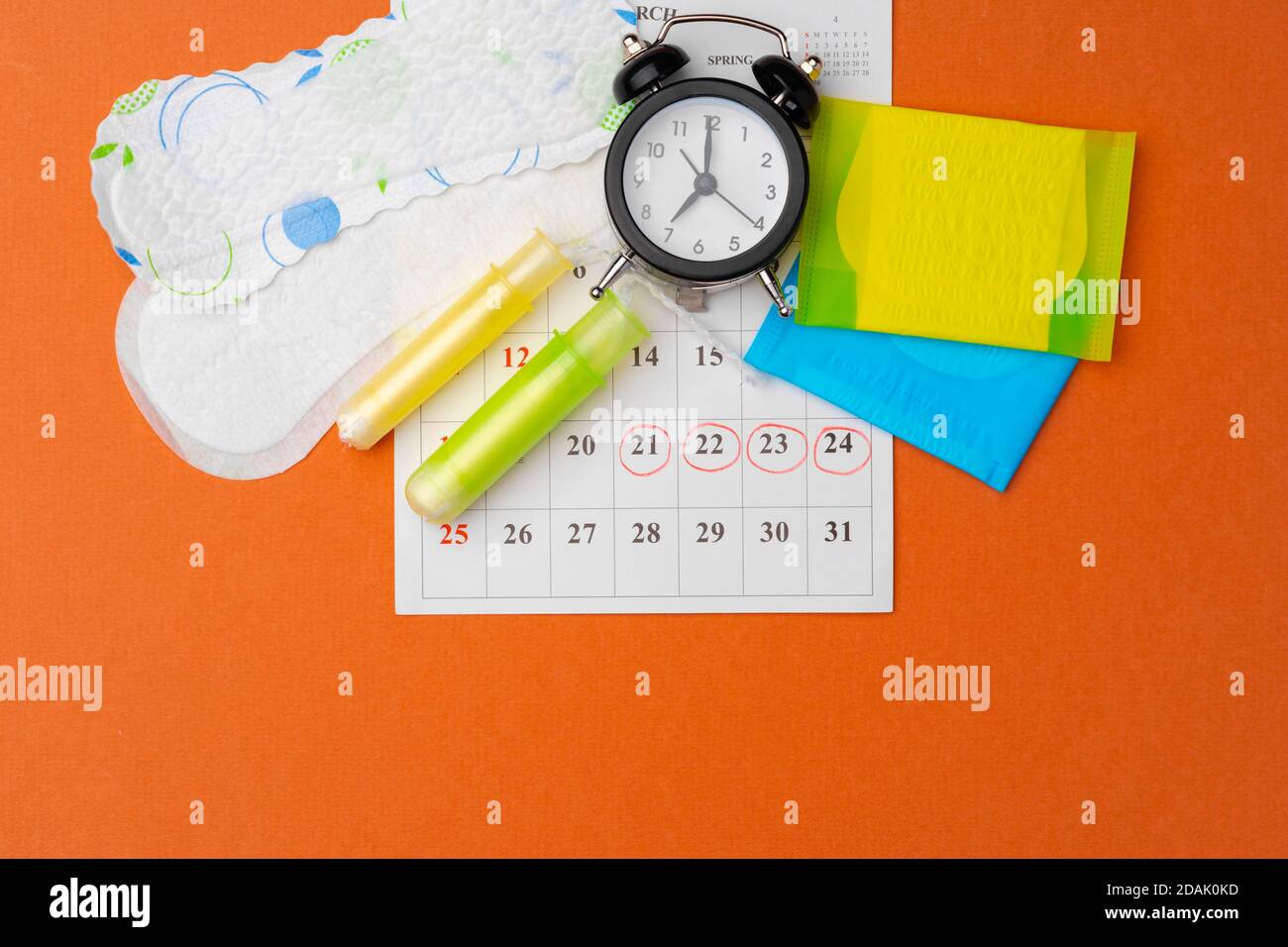 Menstruation calendar with sanitary pads and tampons, pills Stock Photo