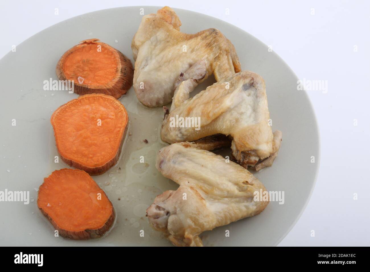 chicken wings with carrot side as ketogenic diet Stock Photo