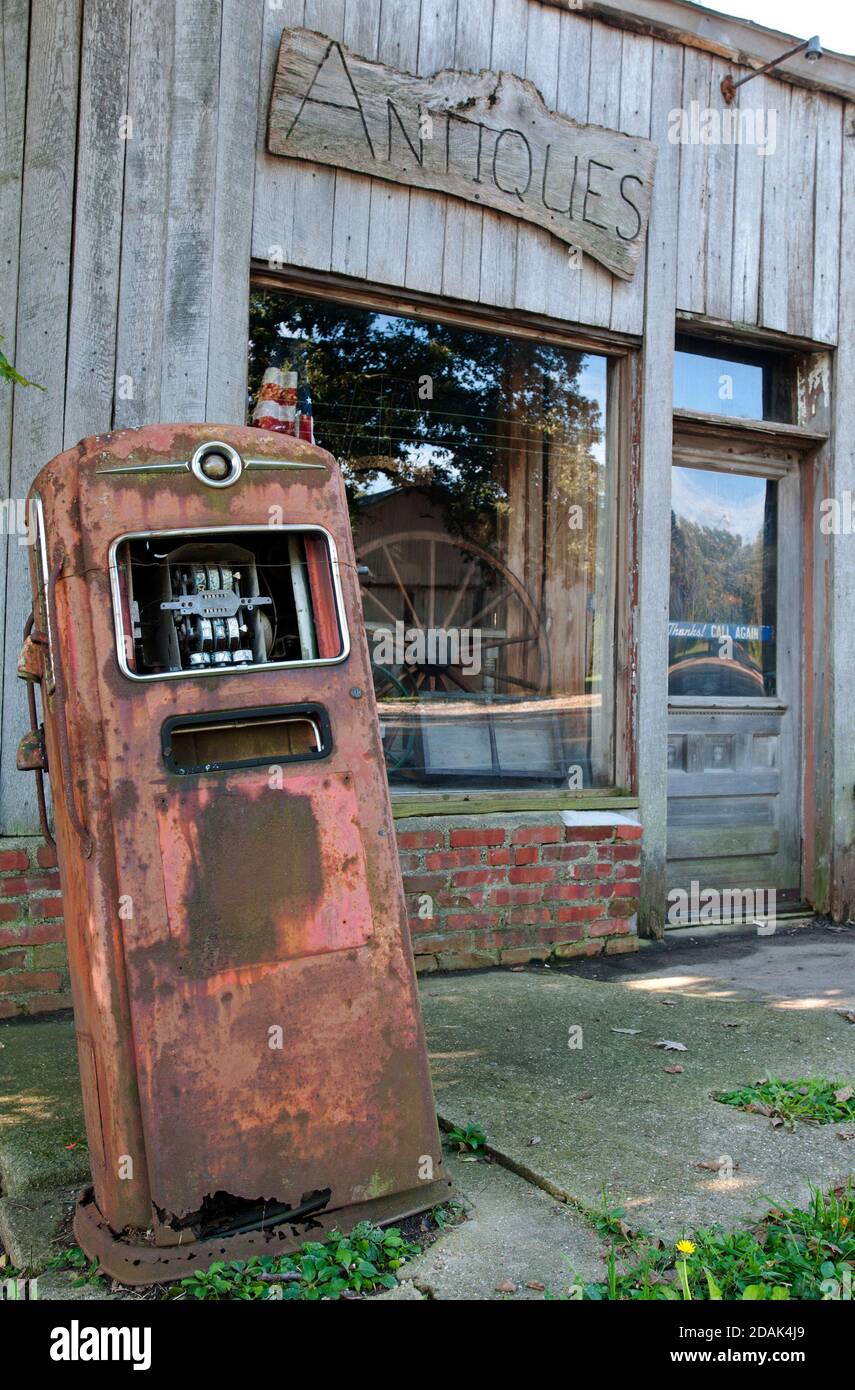 A rusting gas pump stands outside the old Walker General Store, later