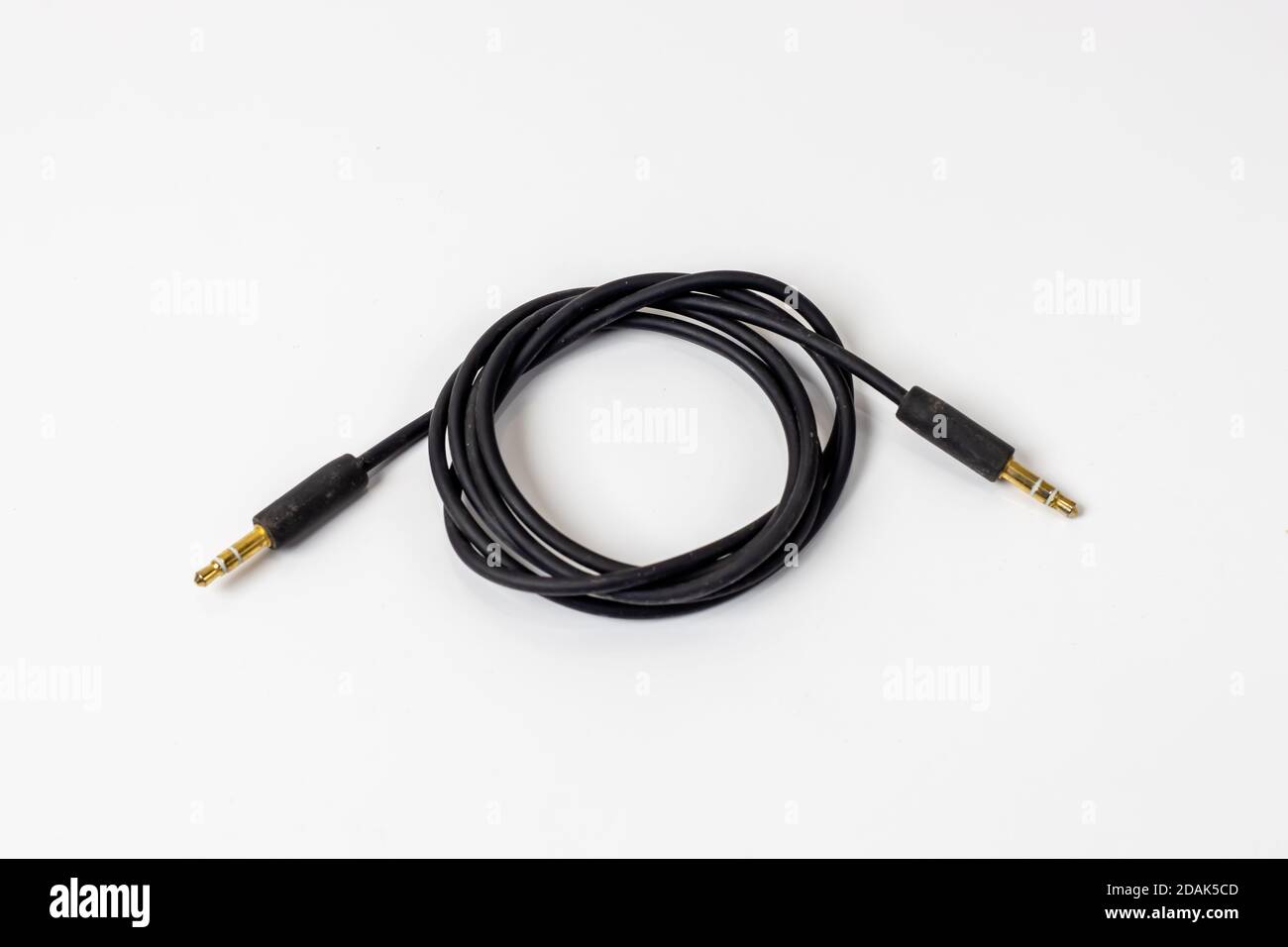 Used headphone connection male jack isolated on white background Stock