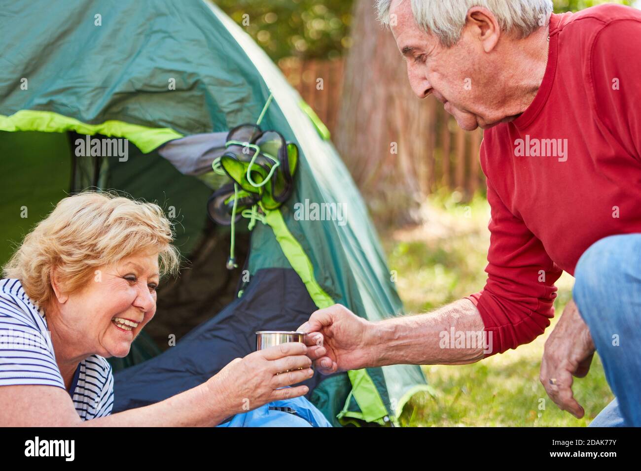https://c8.alamy.com/comp/2DAK77Y/couple-of-seniors-while-camping-drinking-morning-coffee-in-the-tent-at-the-campsite-2DAK77Y.jpg