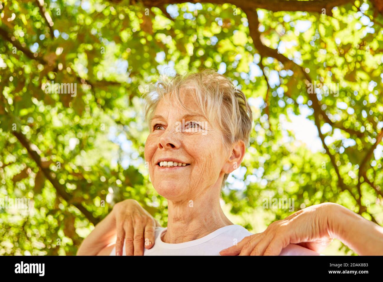 Relaxed senior woman doing a breathing exercise for health and wellbeing Stock Photo