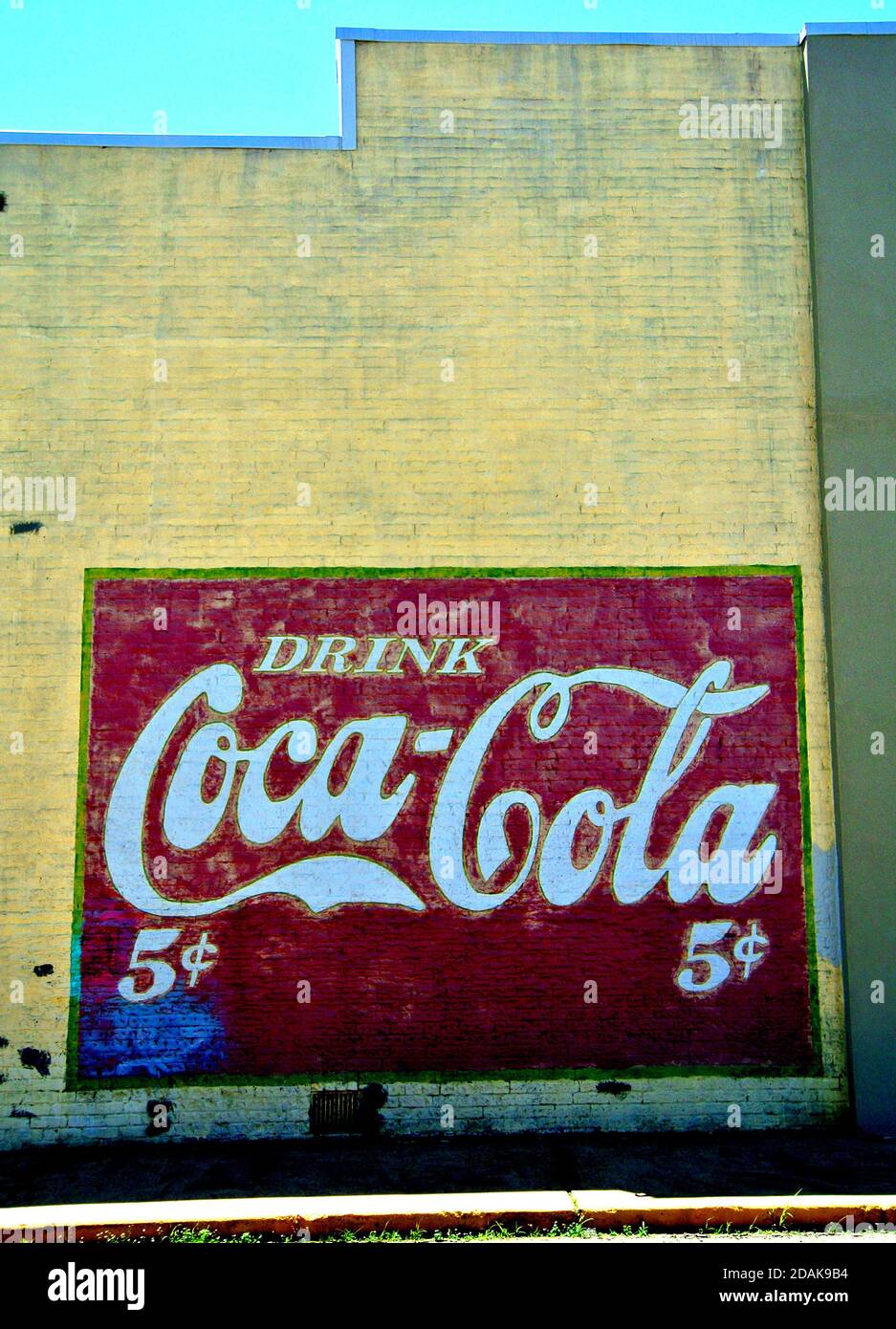 vintage 5 cent coca cola signon historic building in small town wyoming Stock Photo