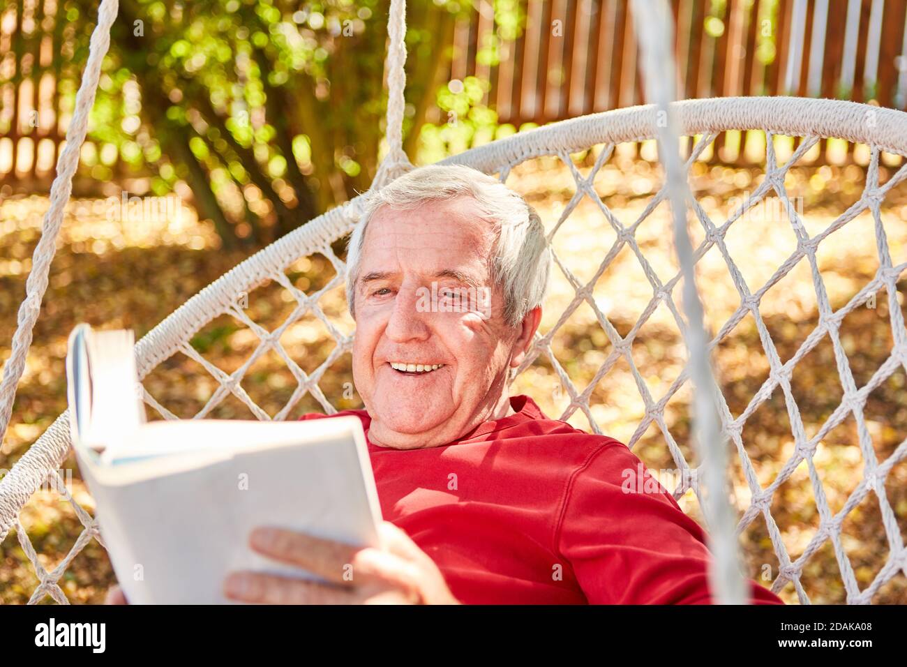 Happy senior man reading hi-res stock photography and images - Alamy
