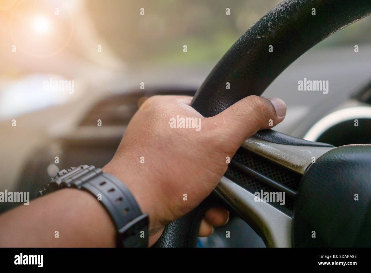 Men's hands are driving, safe driving concept Stock Photo