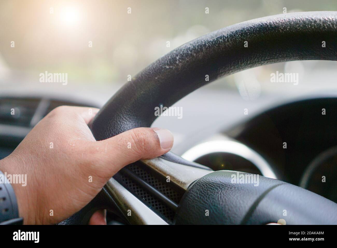 Men's hands are driving, safe driving concept Stock Photo