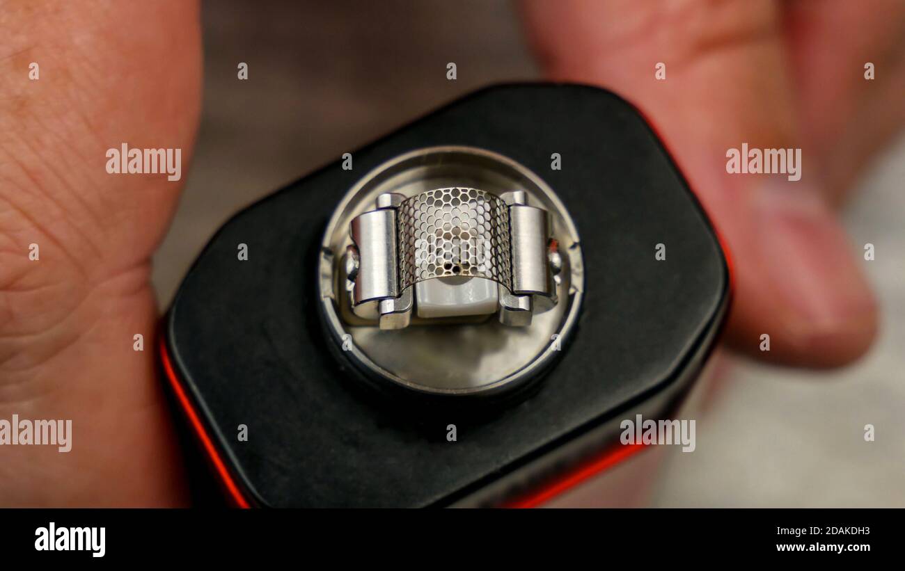 Preparation of mesh coil in the atomizer for vaping Stock Photo Alamy