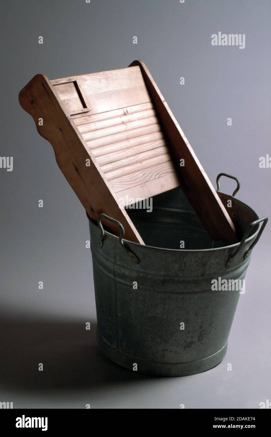 Antique metal bucket and wooden sink for laundry Stock Photo