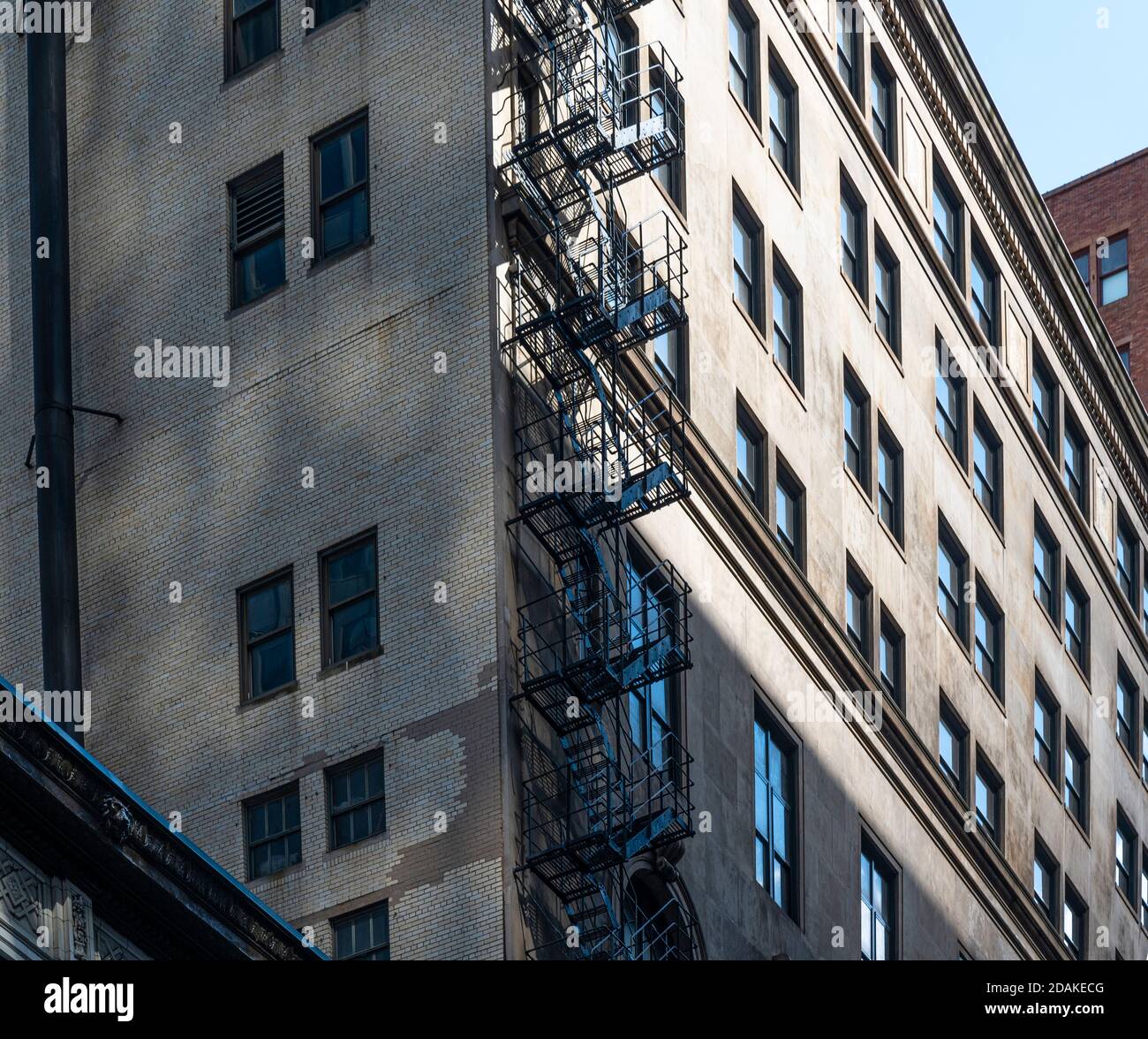 old apartment building in Chicago with outdoor fire escape ladder Stock