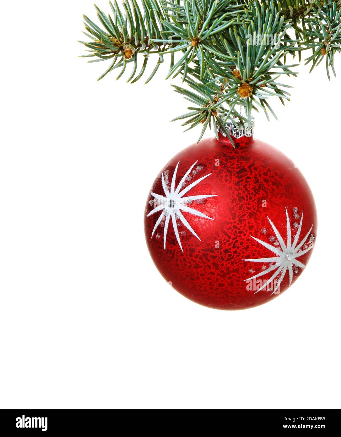 Christmas decoration isolated on the white background. Christmas ball on spruce tree branch. Stock Photo
