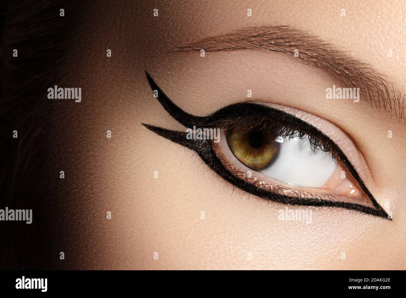 Beautiful macro shot of female eye with fashion black eyeliner makeup.  Perfect graphic liner shape, minimalism style visage. Cosmetics and  make-up. Cl Stock Photo - Alamy
