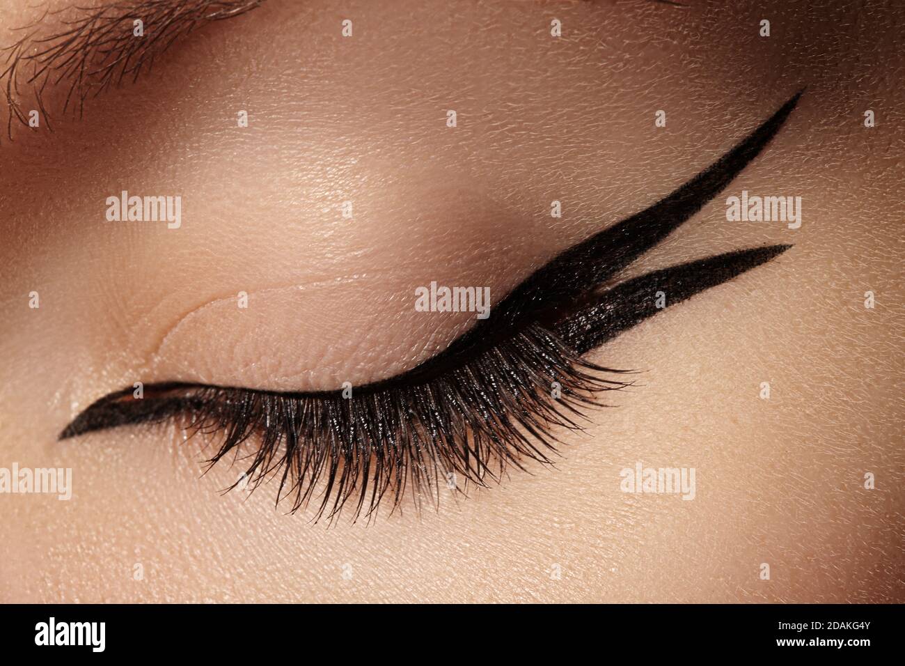 Beautiful macro shot of female eye with fashion black eyeliner makeup.  Perfect graphic liner shape, minimalism style visage. Cosmetics and  make-up. Cl Stock Photo - Alamy