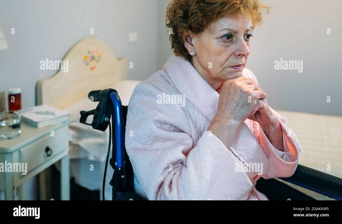 Sad old woman in wheelchair hi-res stock photography and images - Alamy
