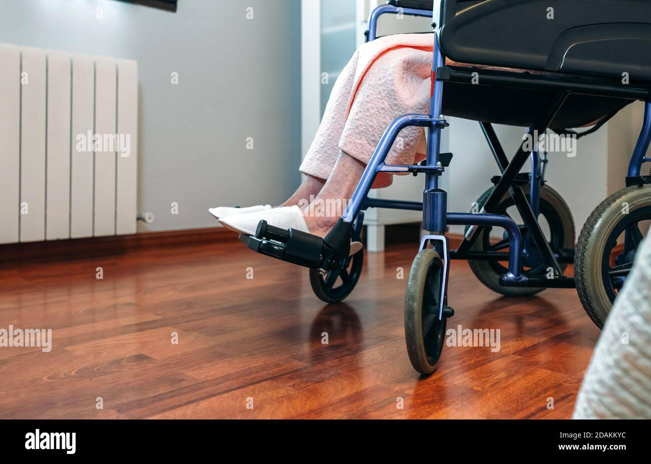 Senior woman in a wheelchair alone Stock Photo