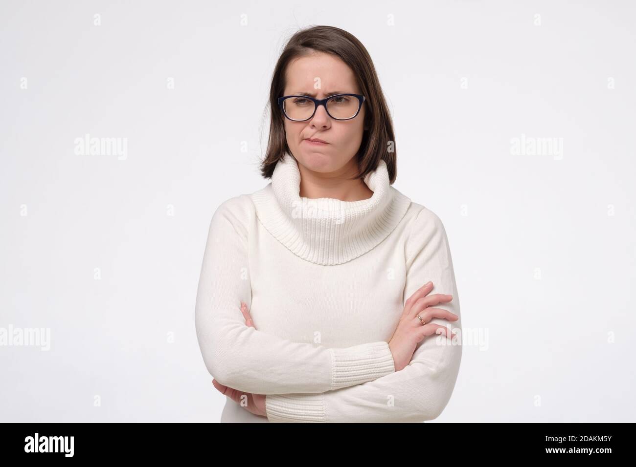 Offended woman keeping arms crossed hi-res stock photography and images ...