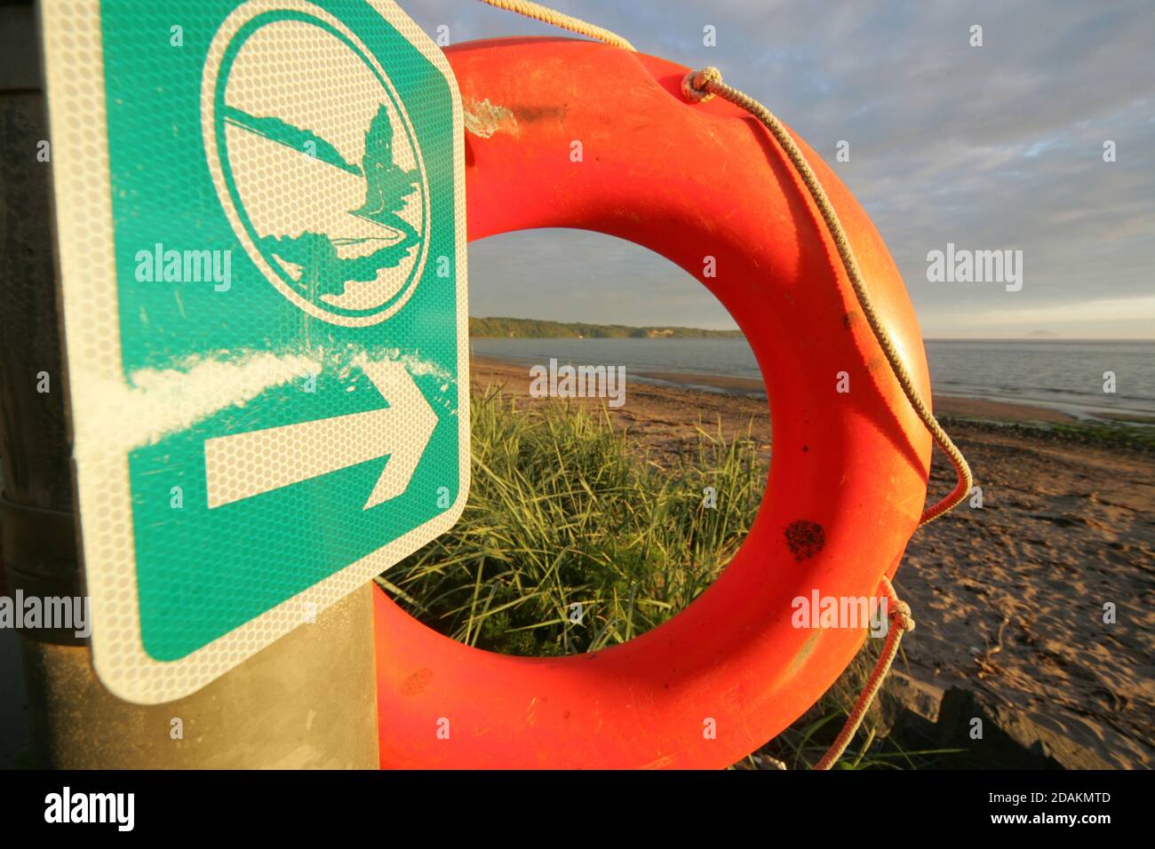 Croy Shore,Ayrshire, Scotland UL  Ayrshire Coastal Path  Sign and lifebelt on shoreline Stock Photo