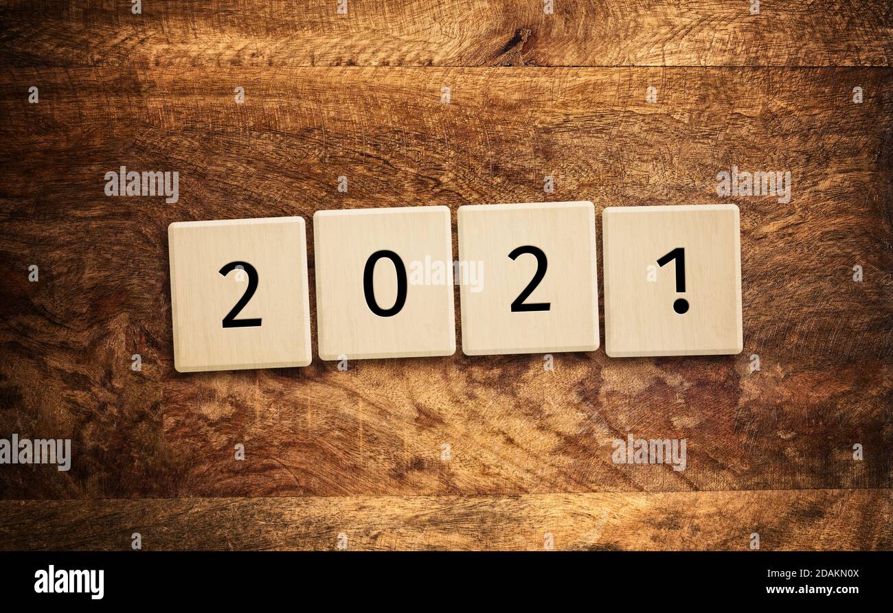 2021 with exclamation mark tiles on wooden table background, top view Stock Photo