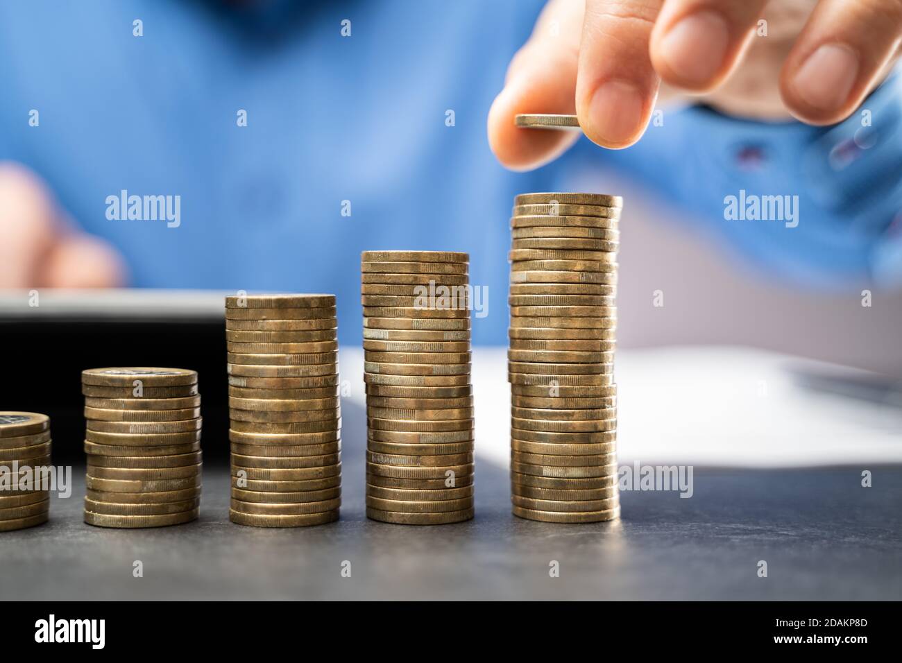 Income Tax And Saving Money Coins. Earnings Growth Stock Photo
