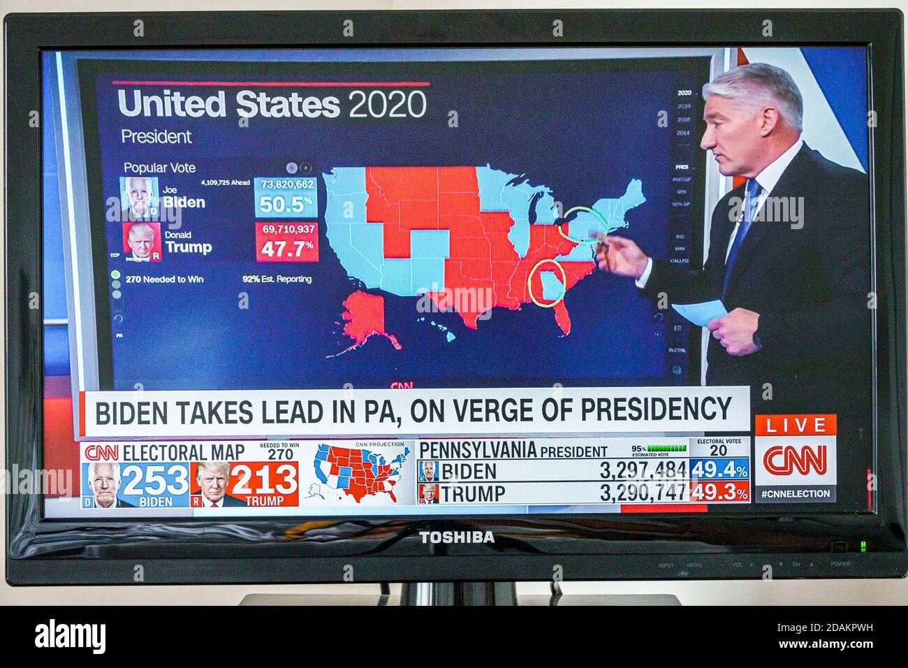 TV cable television screen monitor 2020 US presidential election results,Joe Biden Donald Trump votes electoral college popular vote count,takes lead Stock Photo