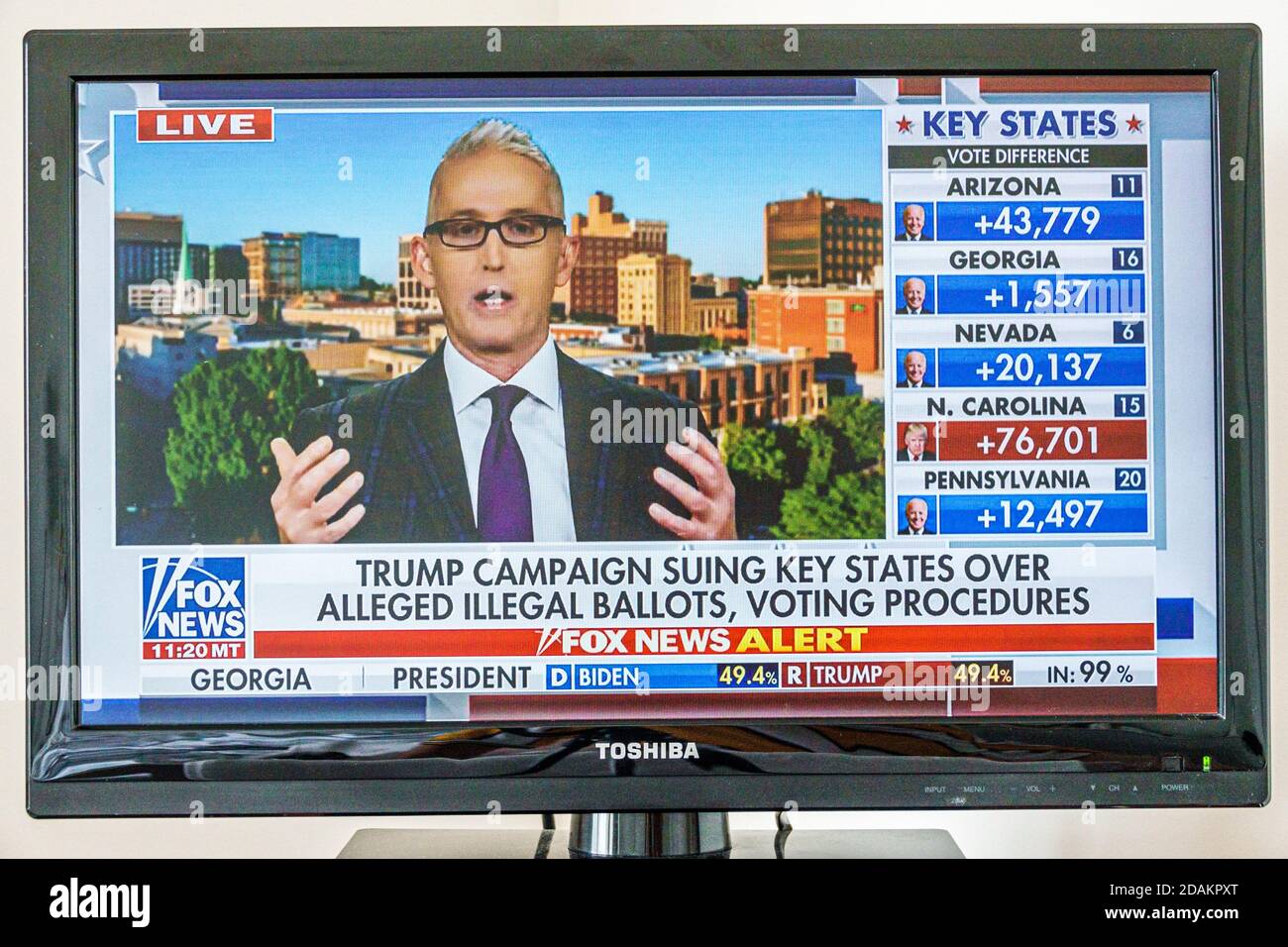 TV cable television screen monitor 2020 US presidential election results,Joe Biden Donald Trump votes electoral college popular vote count,illegal sui Stock Photo
