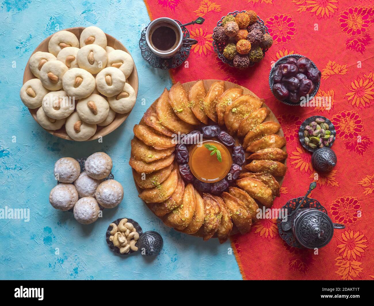 Festive Ramadan food background. Arab sweets. Arabian pancake stuffed with sweet cheese and pistachios. Stock Photo