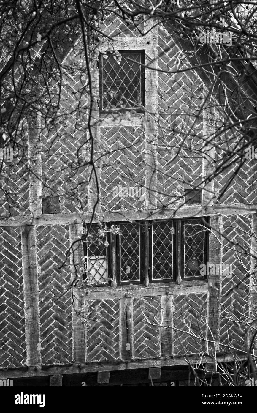 Timber framework and patterned brickwork designs on an old building near Newcastle's historic quayside. Stock Photo