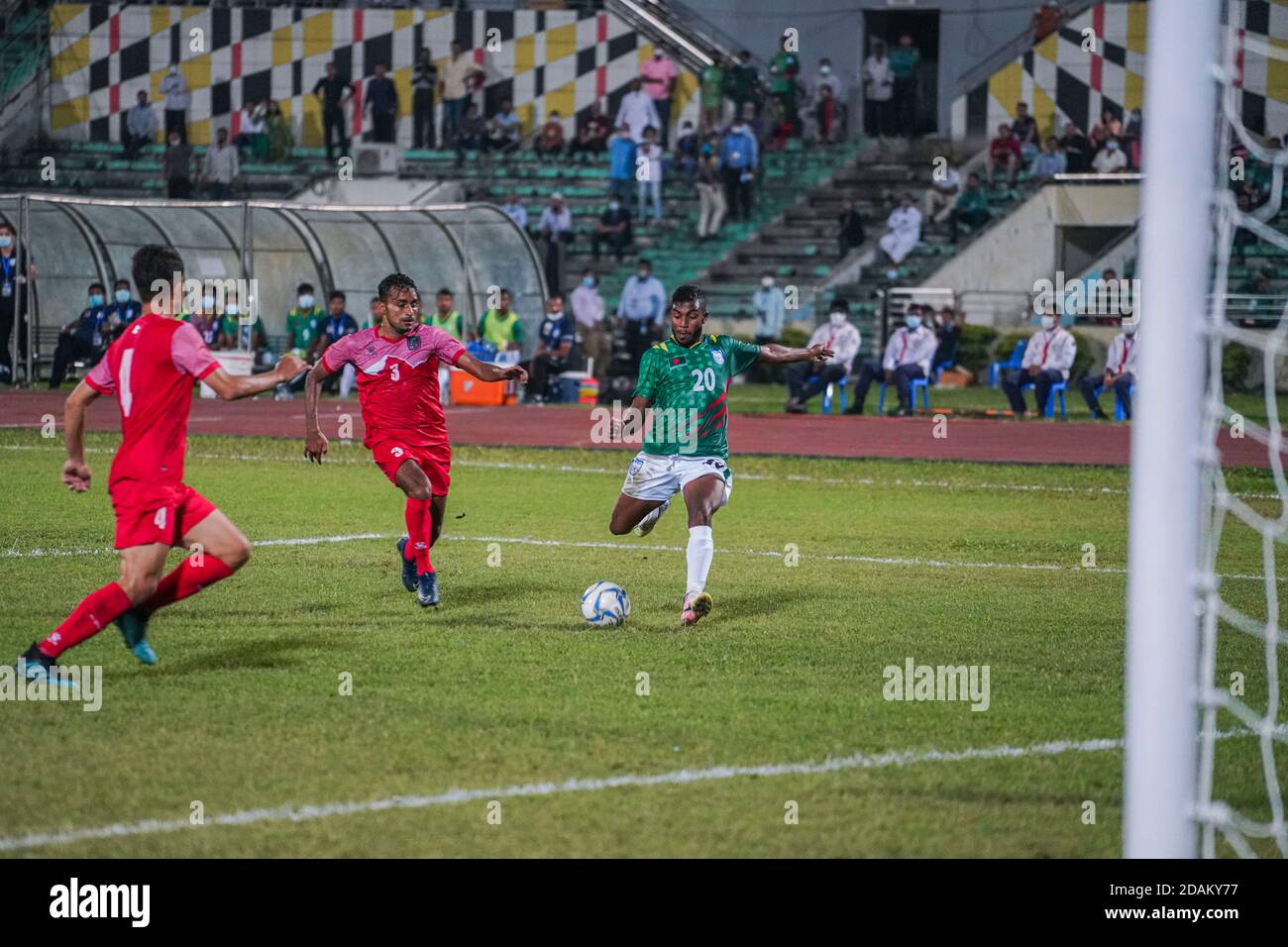 Bangladeshi Mahbubur Rahman (R) seen action during the First FIFA friendly match between Bangladesh and Nepal at Bangabandhu National Stadium in Dhaka.(Final score; Bangladesh 2:0 Nepal) Stock Photo