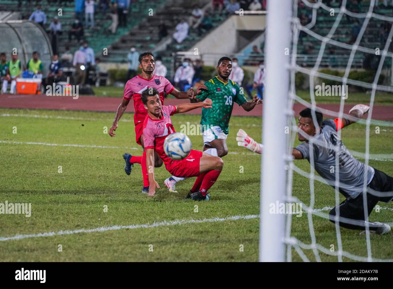 Bangladeshi Mahbubur Rahman (M) seen action during the First FIFA friendly match between Bangladesh and Nepal at Bangabandhu National Stadium in Dhaka.(Final score; Bangladesh 2:0 Nepal) Stock Photo