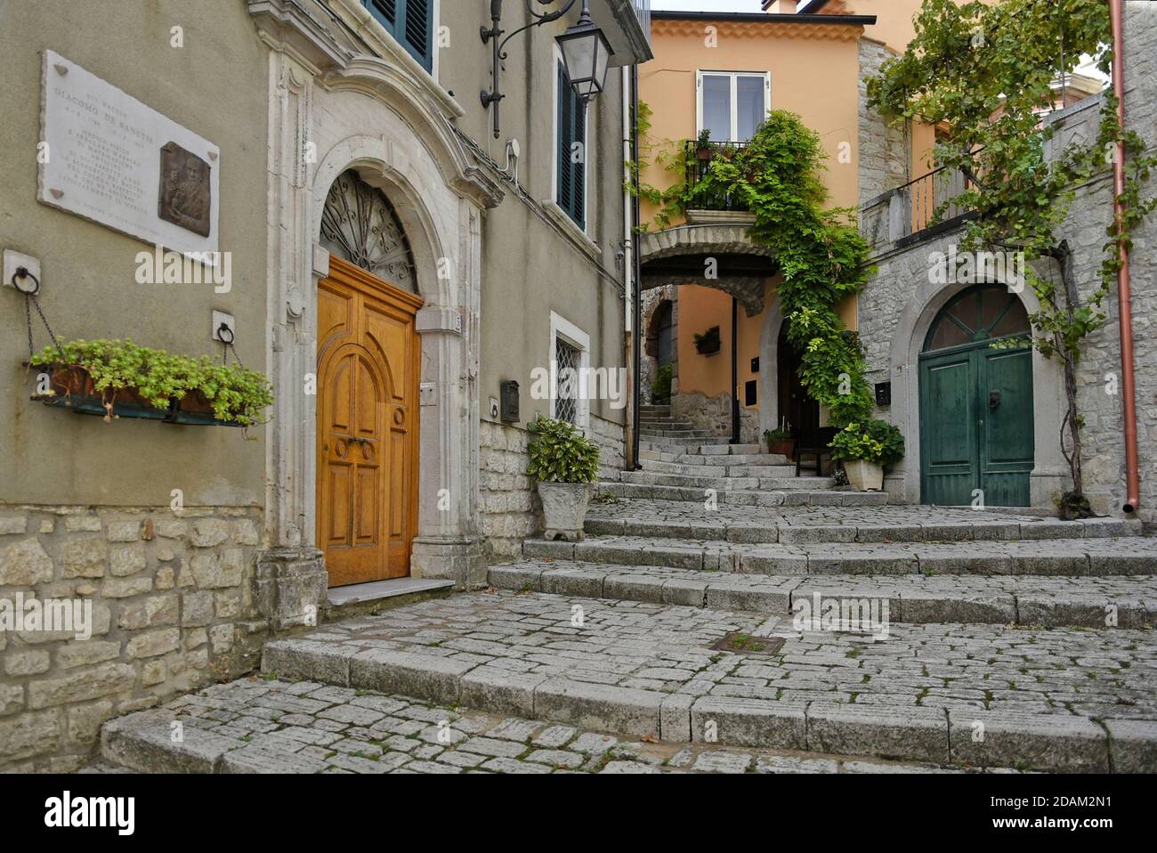 A narrow street among the old houses of Ferrazzano, a medieval village in the Molise region, Italy. Stock Photo