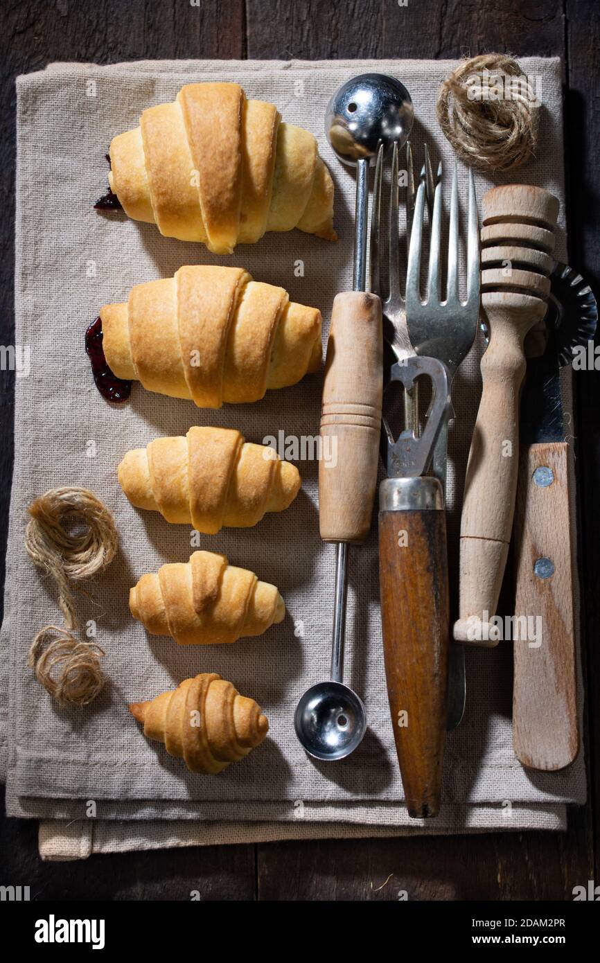 Sweet croissants.Healthy breakfast.Delicious food and drink.Wooden table. Stock Photo