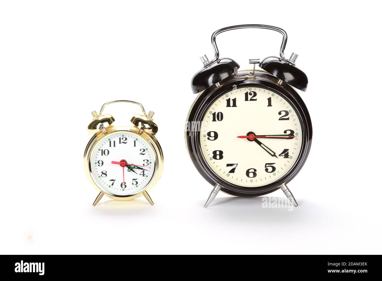 Closeup shot of a two vintage alarm clock on a white background Stock ...