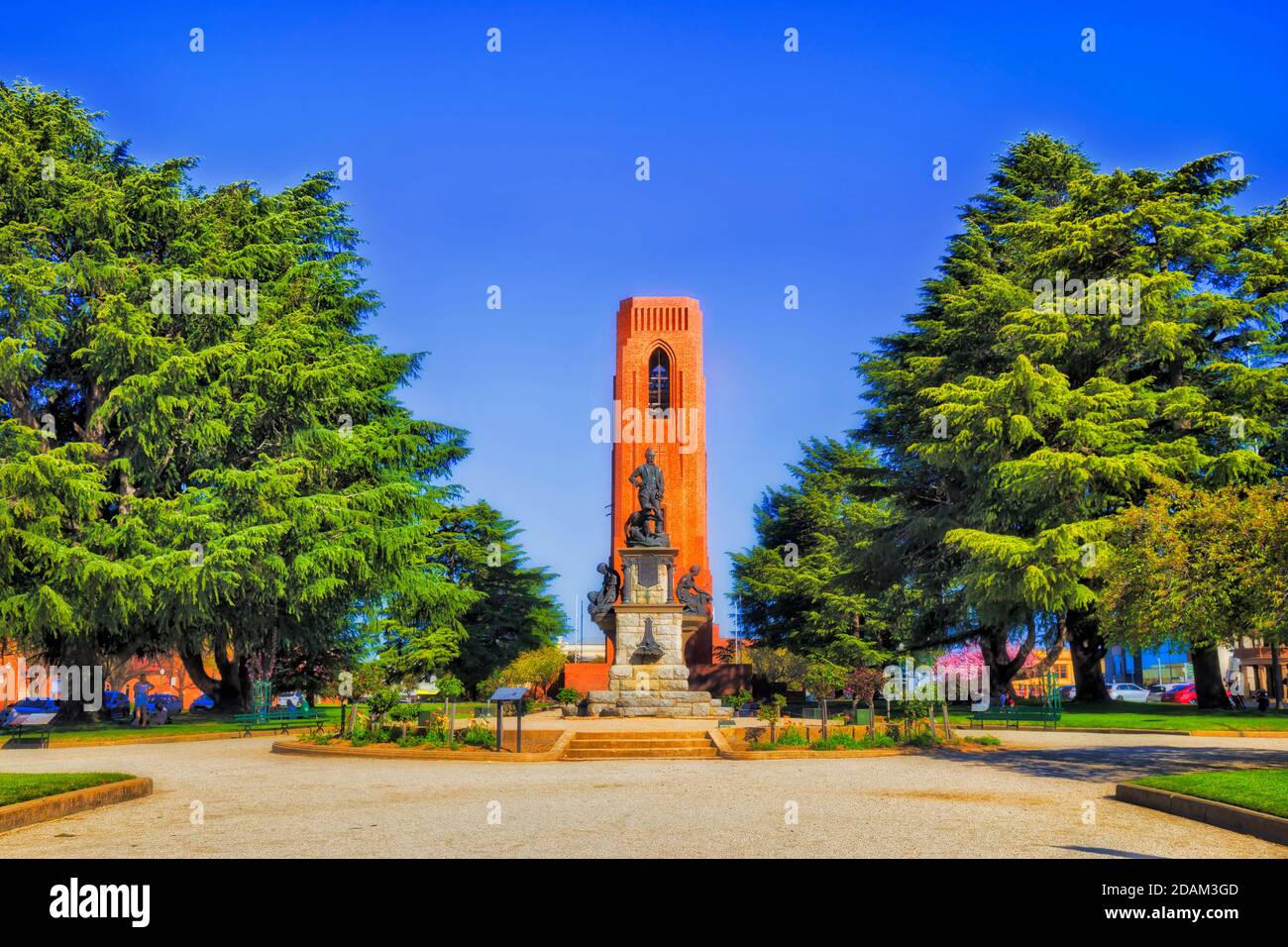 Public park in Bathurst city of regional Australia on a sunny day with statue and war memorial around bell tower - kings parade and George street. Stock Photo