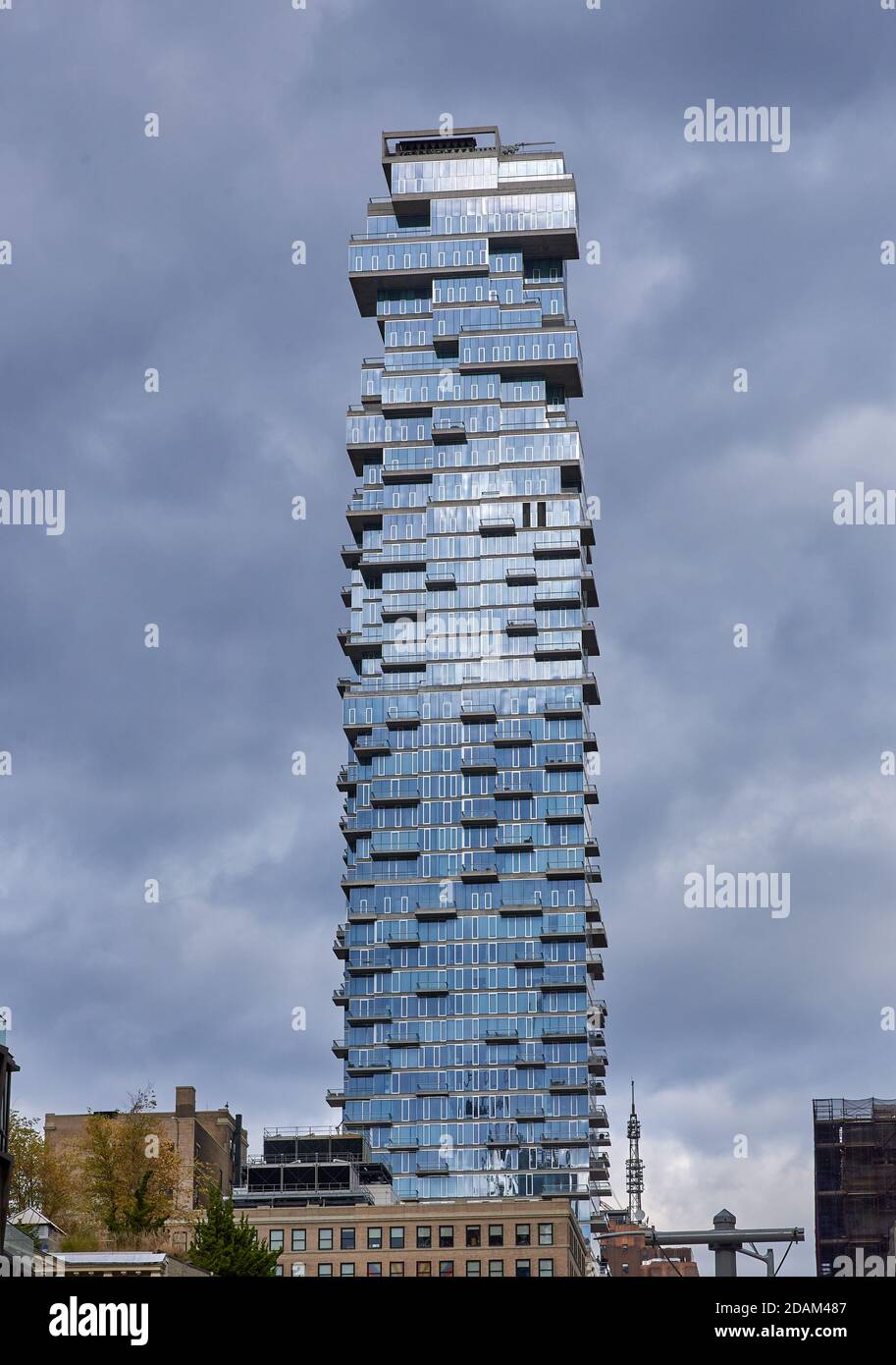 New York, NY - November 3 2020: 56 Leonard St or Jenga Tower (2017) catches the sunlight on a grey autumn day. It is a 60 story residence that looks l Stock Photo