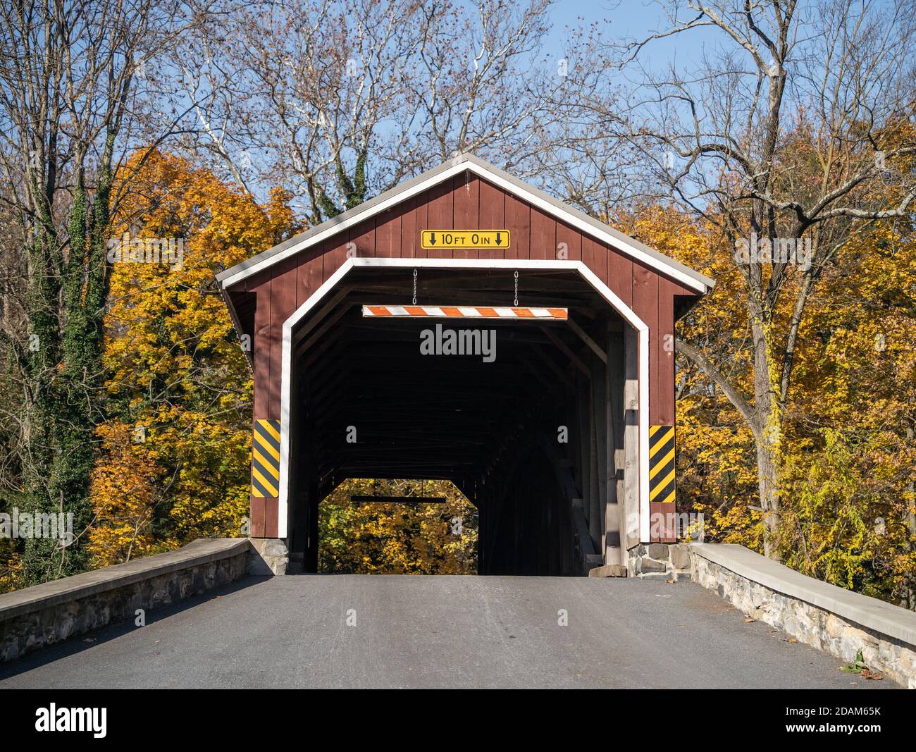 Autumn scene of Amish Red Covered Bridge in Rural Lancaster County, Pennsylvania Stock Photo