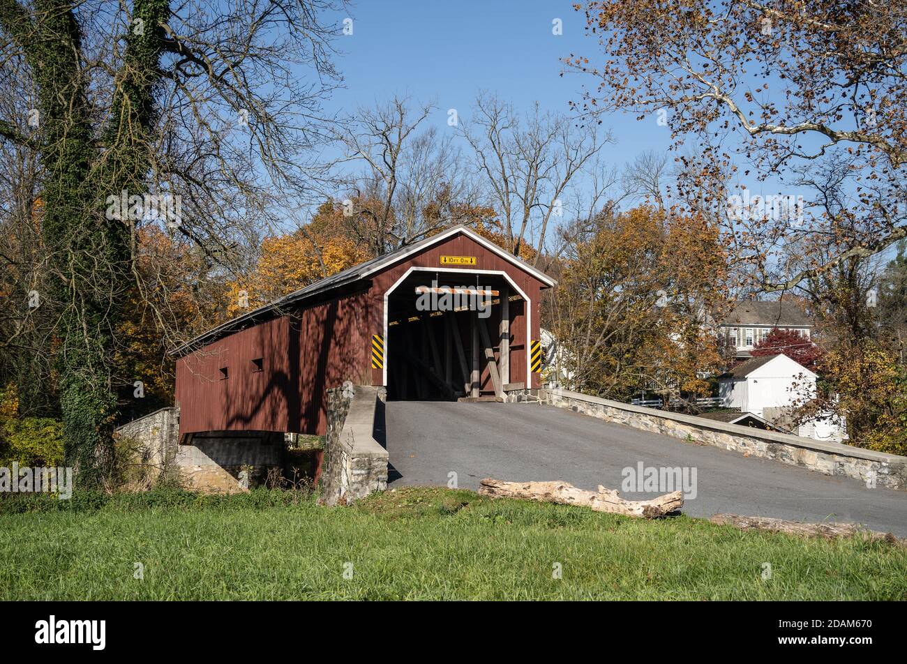 Autumn scene of Amish Red Covered Bridge in Rural Lancaster County, Pennsylvania Stock Photo