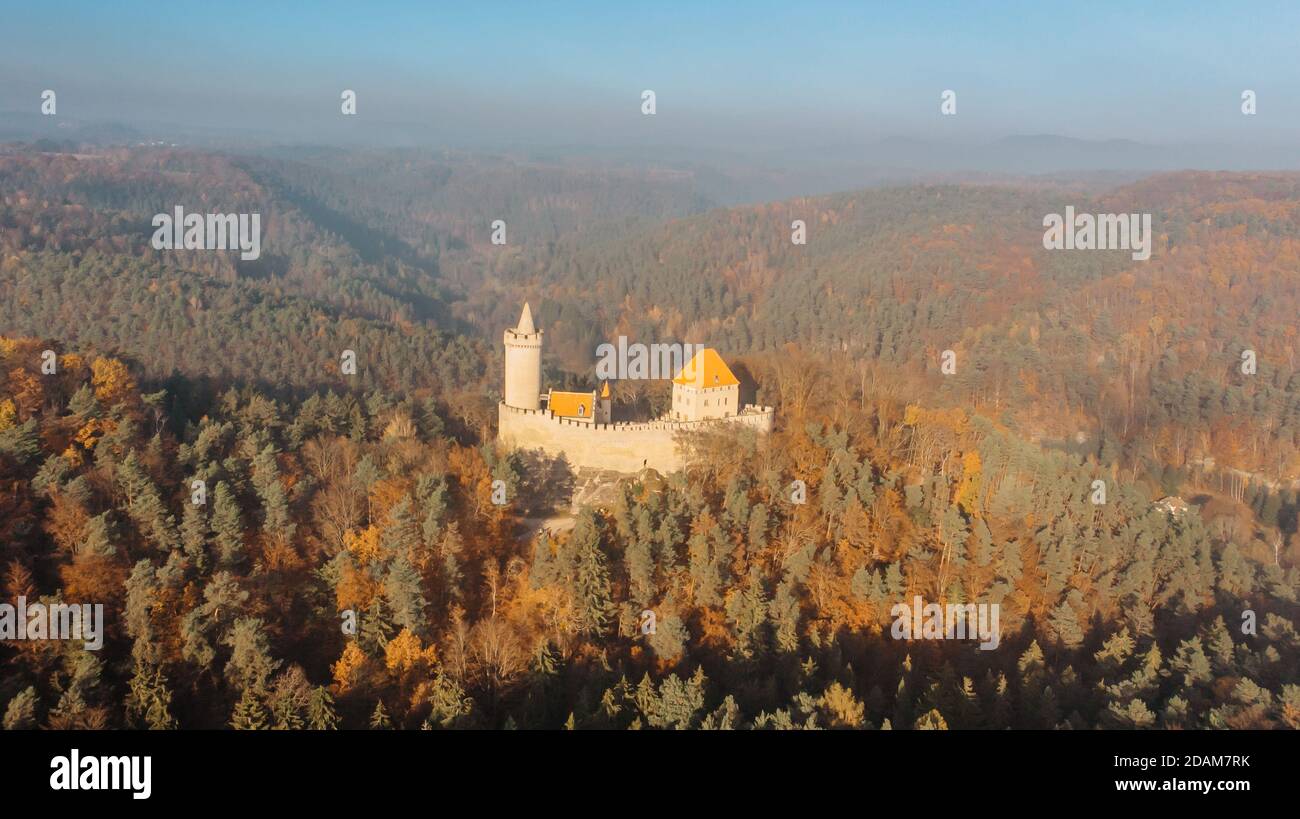Aerial fall view of old stone Kokorin Castle built in 14th century.It lies in the middle of nature reserve on a steep rocky spur above the Kokorin Val Stock Photo