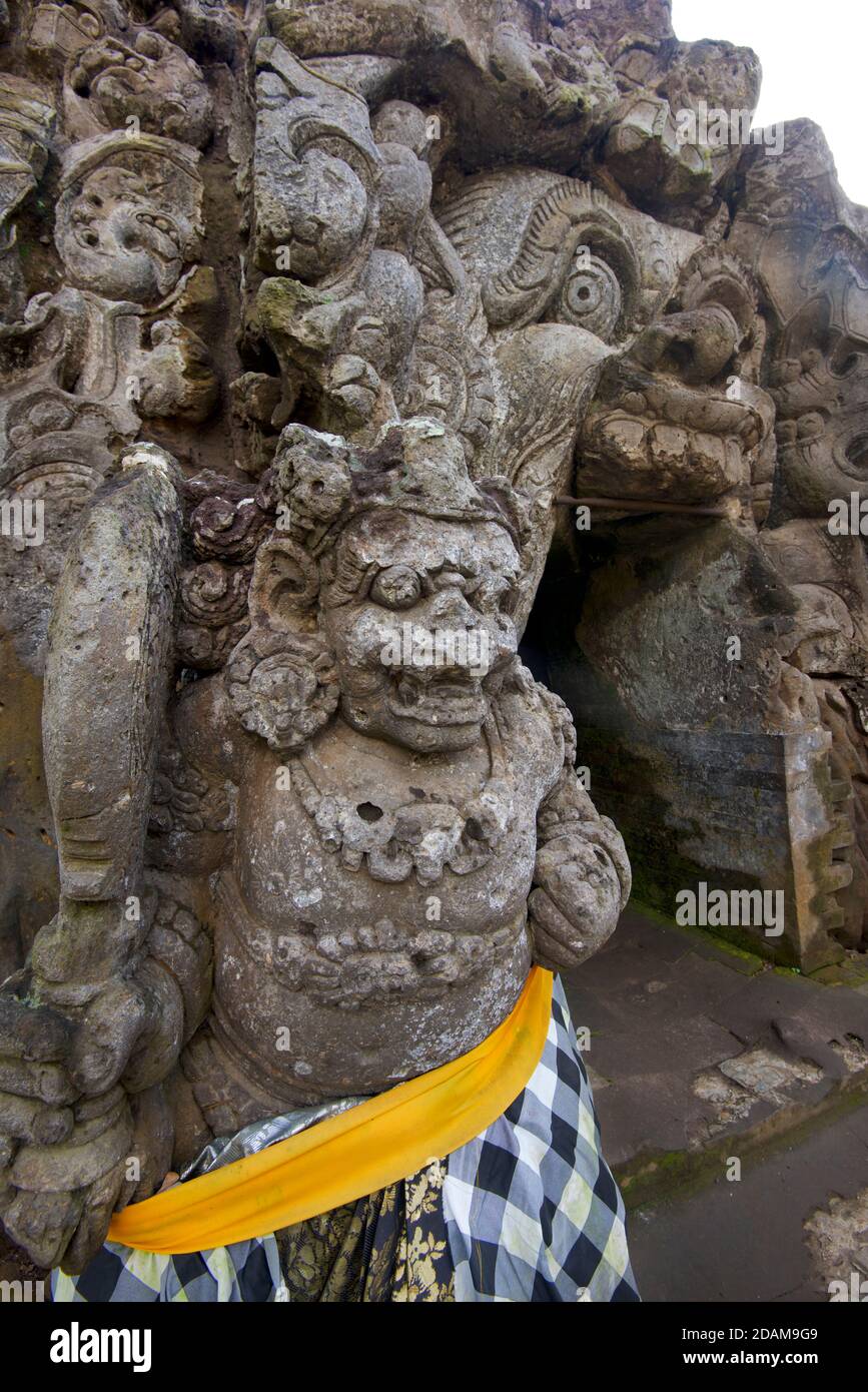Rakasa - mythical Hindu demon-guardian with long teeth at entrance to Goa Gajah cave,  Ubud, Indonesia. Stock Photo