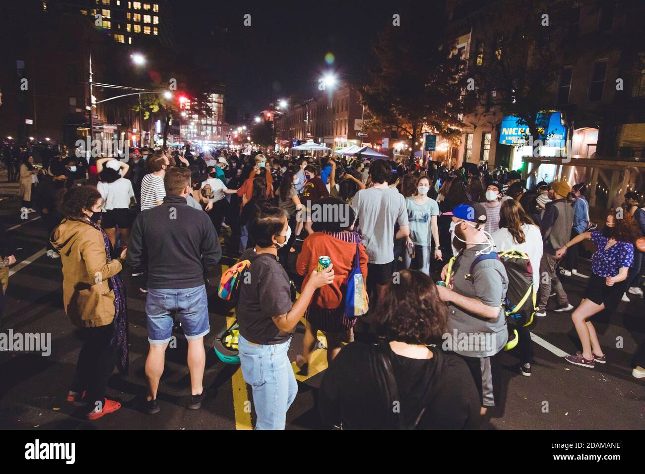 Crowd of People Celebrating President-Elect Joe Biden at Night, Brooklyn, New York, USA Stock Photo