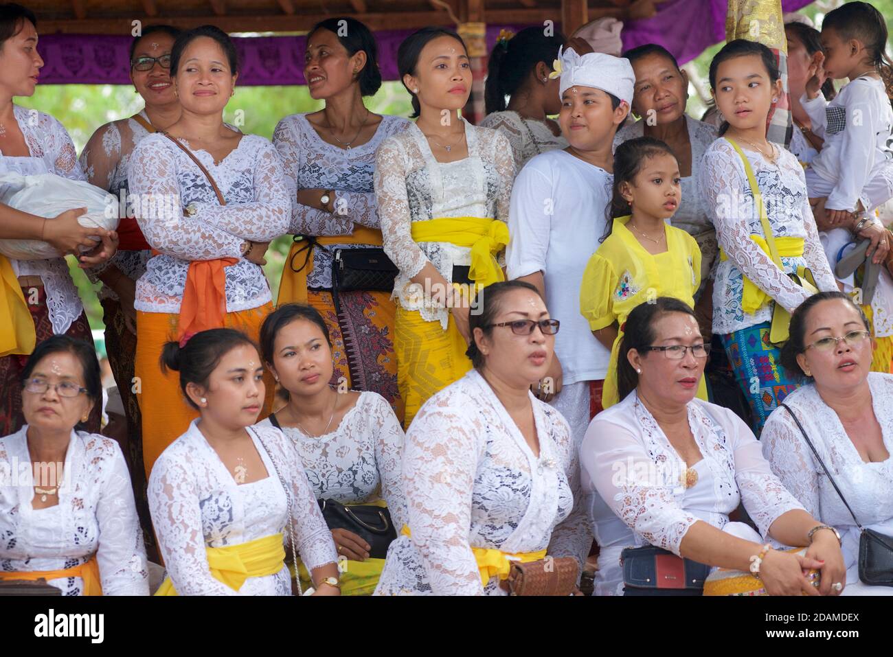 Balinese group mainly women, in festive dress for celebrations to mark Galungan, Sakenan temple, Bali, Indonesia Stock Photo