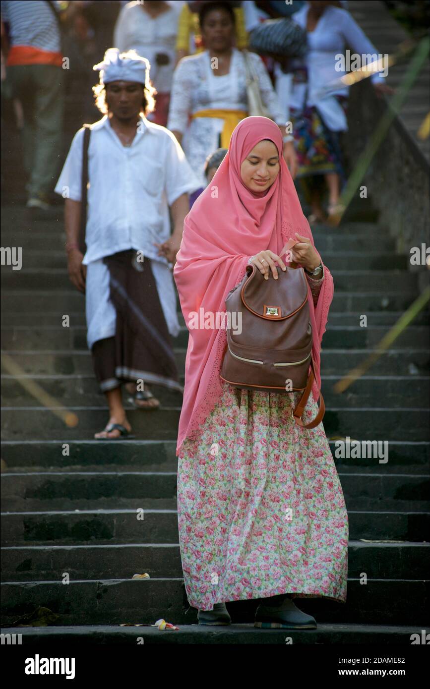 Visitors walking down the steps that lead to Pura Luhu Uluwatu temple.  Bali, Indonesia Stock Photo
