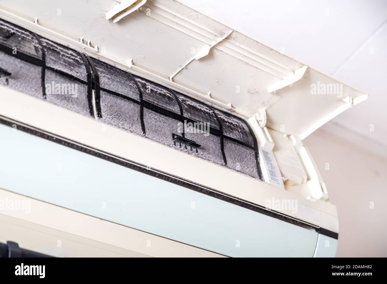 Air conditioner with filter full of unhygienic trapped dust Stock Photo