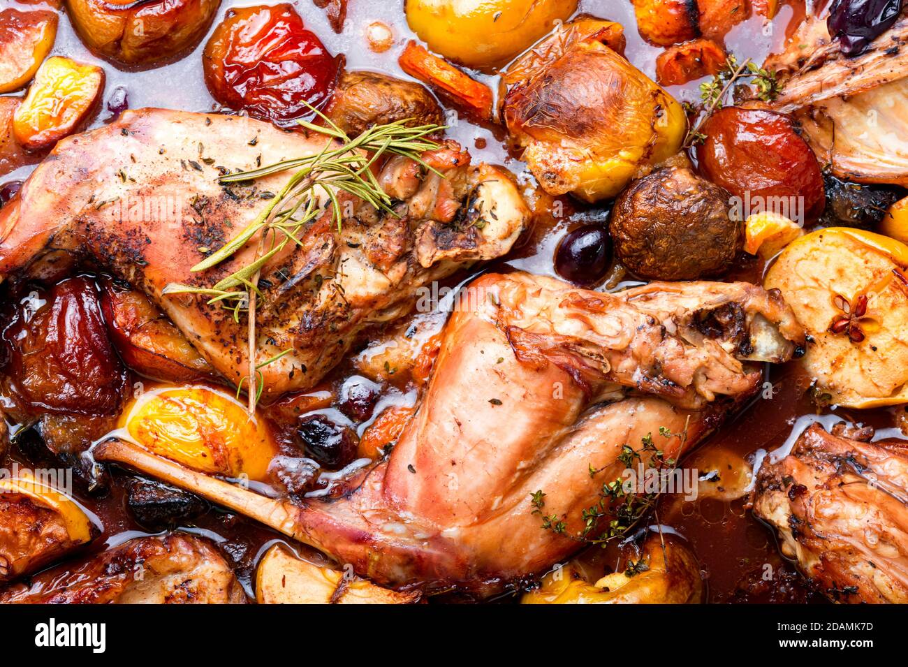 Delicious baked rabbit meat with fruits.Food background,close up Stock ...