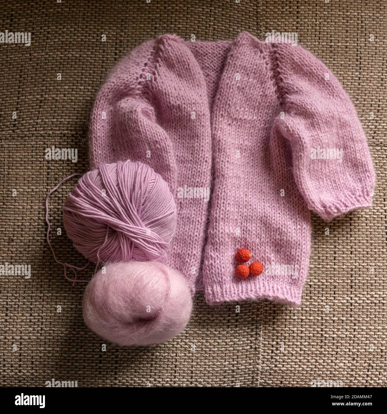 knitted jacket for a girl, pink color, knitting texture, handicraft ...