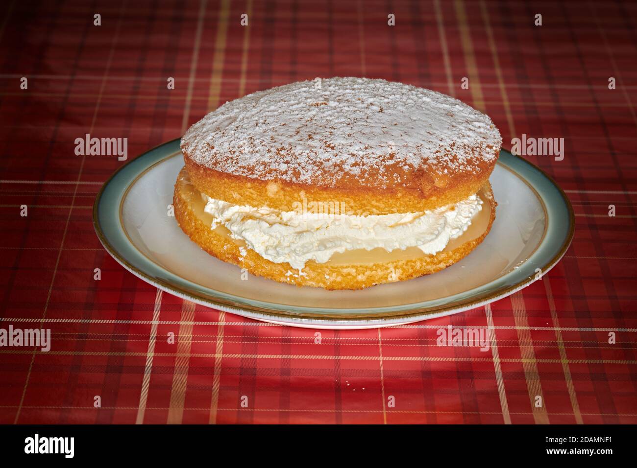 Whole lemon cream sponge cake. Stock Photo