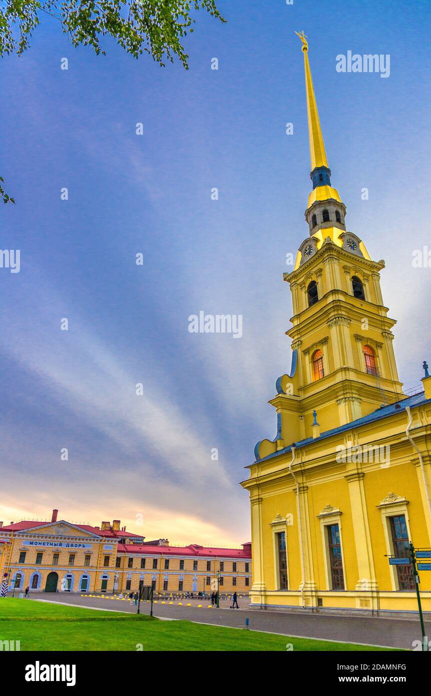 Saints Peter and Paul Cathedral Orthodox church with golden spire, Saint Petersburg Mint in Peter and Paul Fortress on Zayachy Hare Island, vertical v Stock Photo