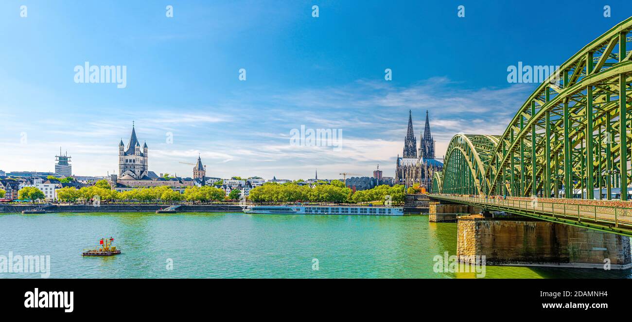 Panorama of Cologne city historical centre with Cologne Cathedral of Saint Peter, Great Saint Martin Roman Catholic Church buildings and Hohenzollern Stock Photo